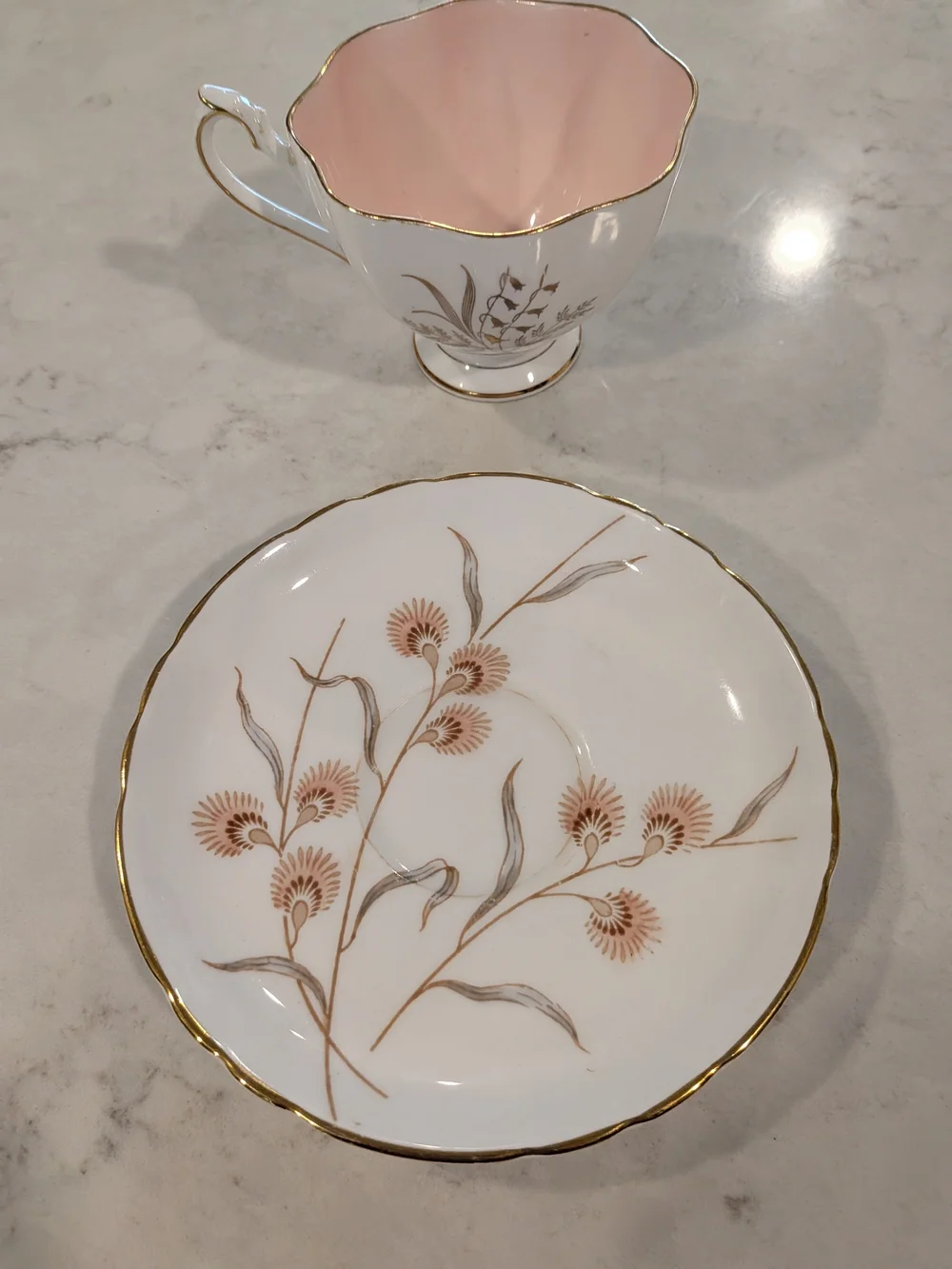 Pink Interior Porcelain Teacup and Saucer with Gold Floral Trim Differen Maker